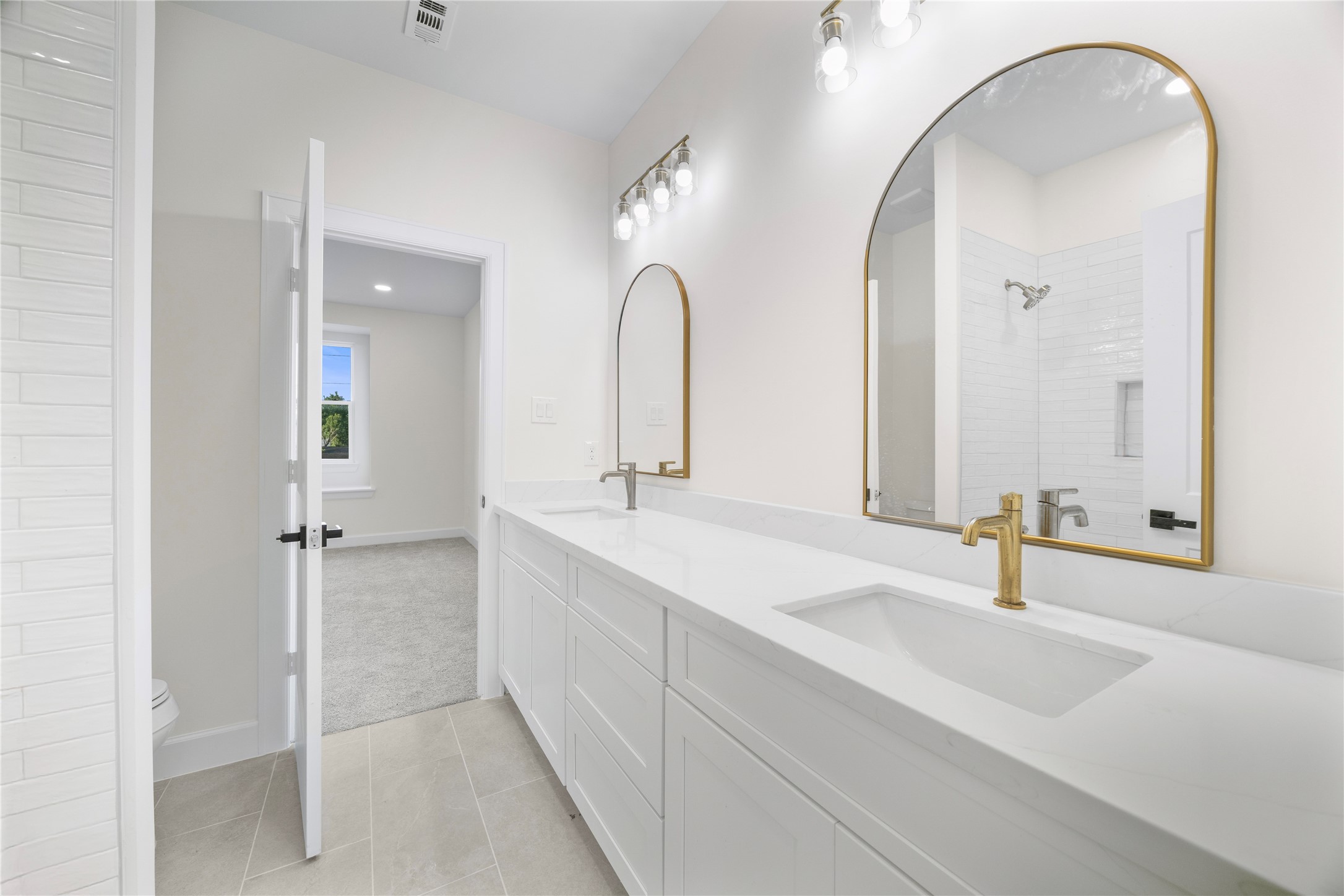 8646 Alcott Drive Houston, TX 77080 - Photo 35 of 44 a bathroom with a sink and a mirror