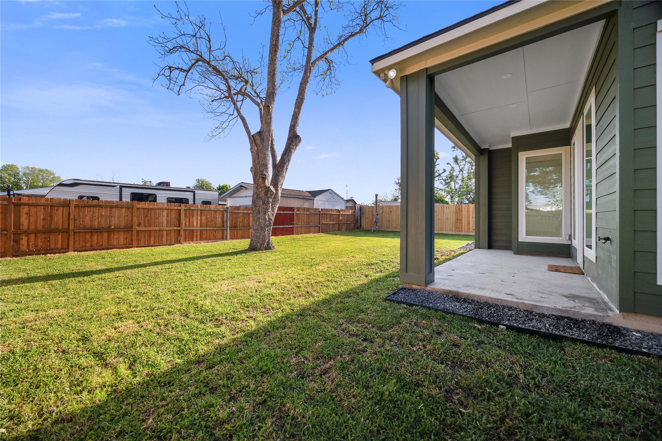 8646 Alcott Drive Houston, TX 77080 - Photo 40 of 44 a view of a house with backyard and a tree
