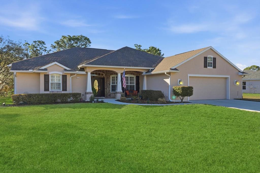 6 Carnation Court Homosassa, FL 34446 - Photo 2 of 48 front view of a house with a yard