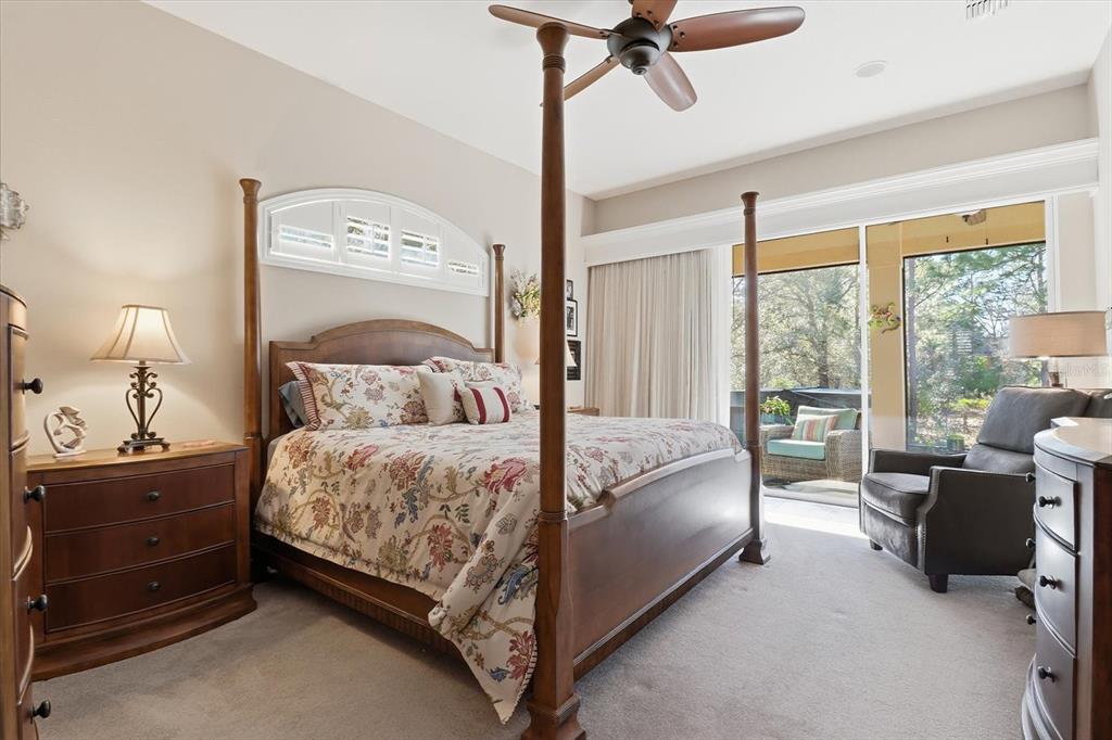 6 Carnation Court Homosassa, FL 34446 - Photo 21 of 48 a bedroom with a bed and a couch