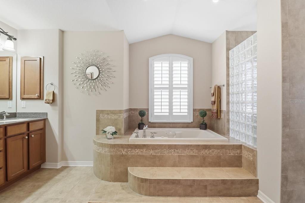 6 Carnation Court Homosassa, FL 34446 - Photo 25 of 48 a spacious bathroom with a tub sink and mirror