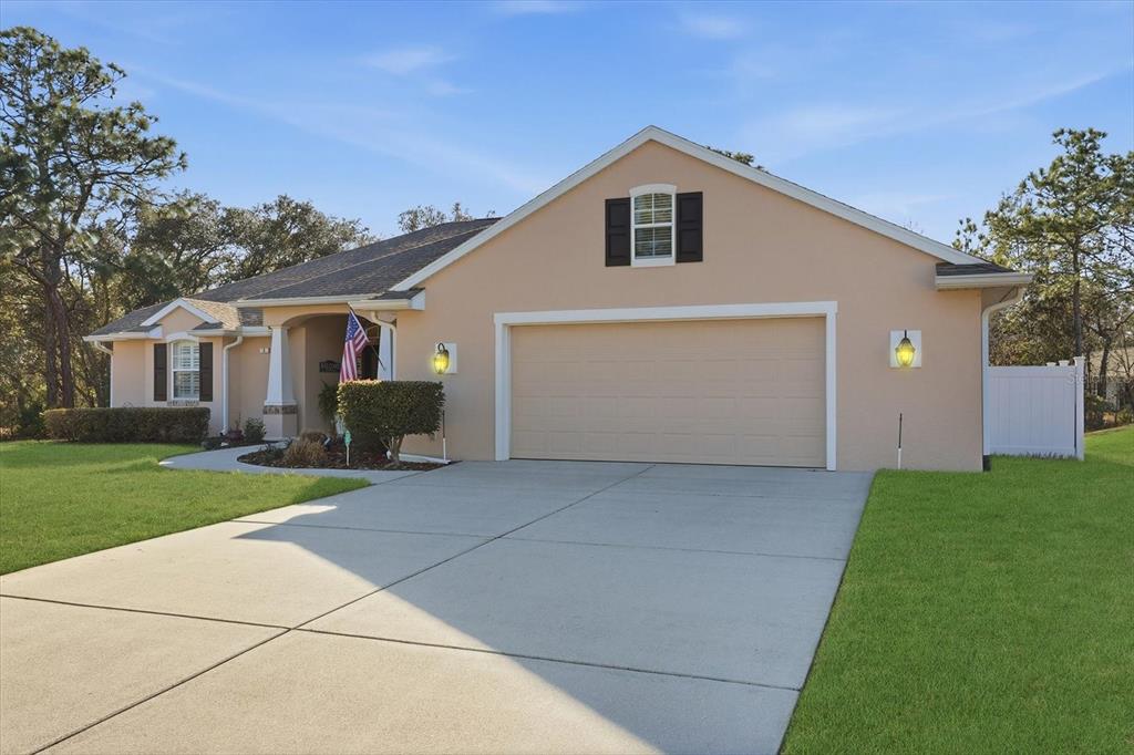 6 Carnation Court Homosassa, FL 34446 - Photo 3 of 48 a front view of house with yard and green space