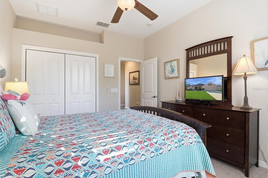 6 Carnation Court Homosassa, FL 34446 - Photo 31 of 48 a bedroom with a bed and a flat screen tv