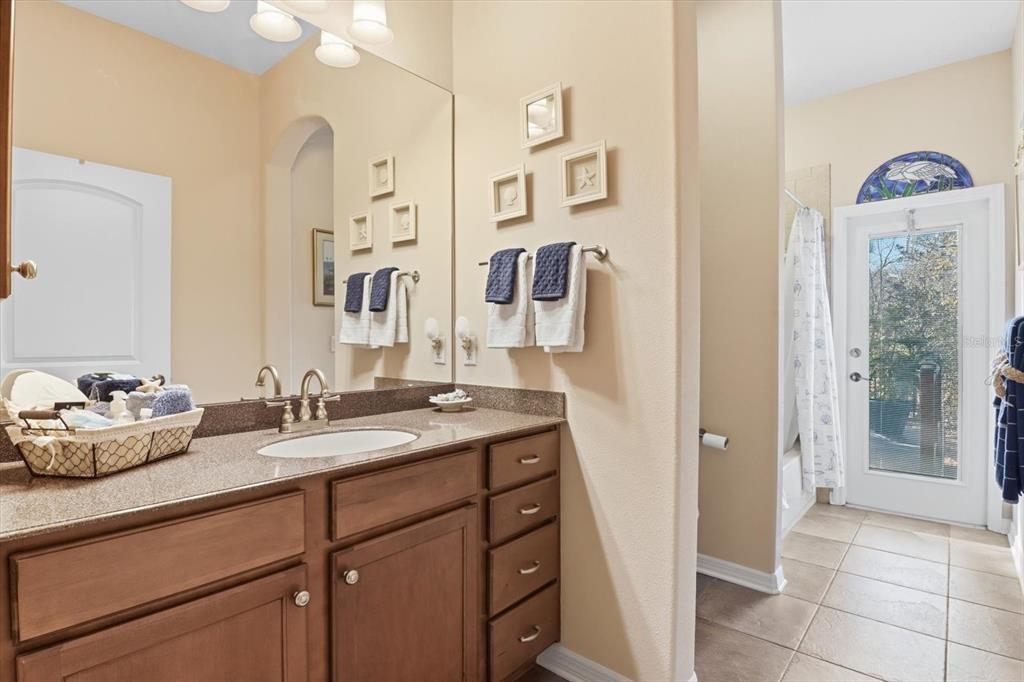 6 Carnation Court Homosassa, FL 34446 - Photo 32 of 48 a spacious bathroom with a sink mirror and vanity