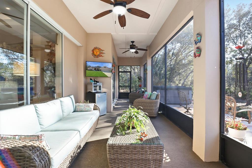 6 Carnation Court Homosassa, FL 34446 - Photo 36 of 48 a living room with furniture and a floor to ceiling window