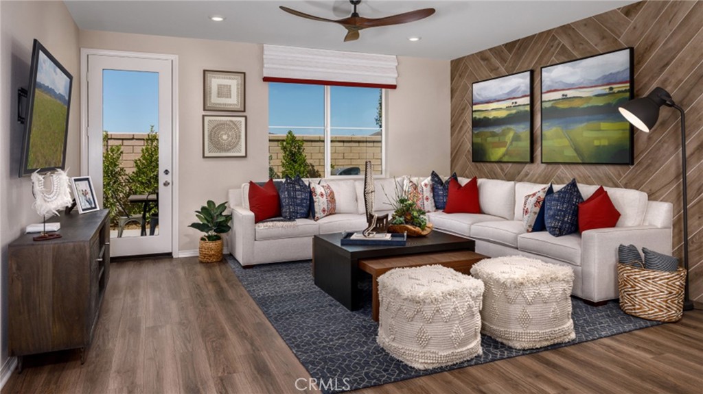 5222 Chaps Way Hemet, CA 92545 - Photo 2 of 15 a living room with furniture and a flat screen tv