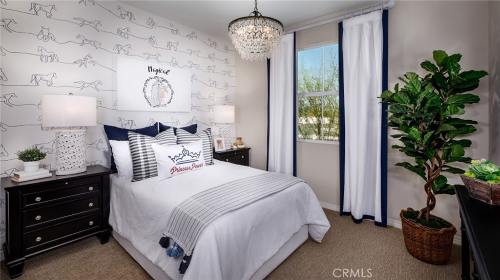 5222 Chaps Way Hemet, CA 92545 - Photo 7 of 15 a bedroom with a bed and a potted plant