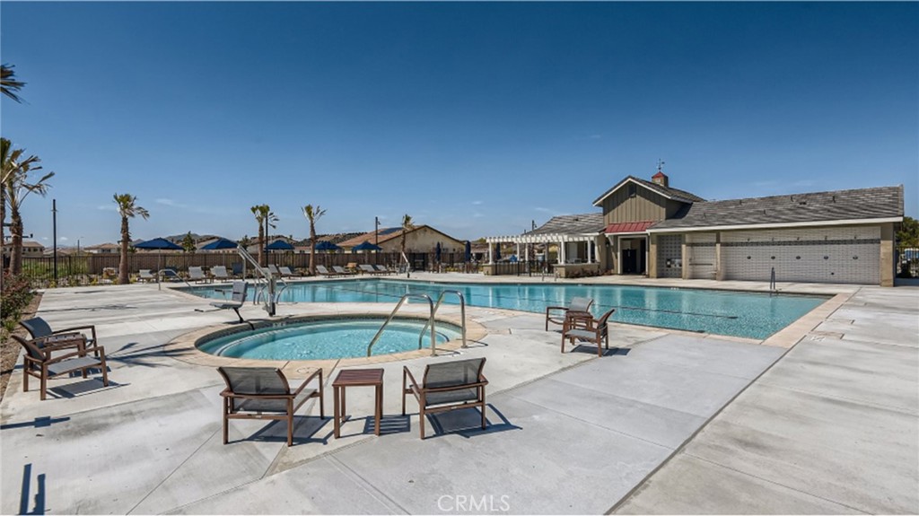 5222 Chaps Way Hemet, CA 92545 - Photo 9 of 15 a swimming pool with outdoor seating and yard