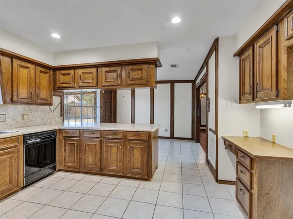 a kitchen with stainless steel appliances granite countertop a stove and a sink