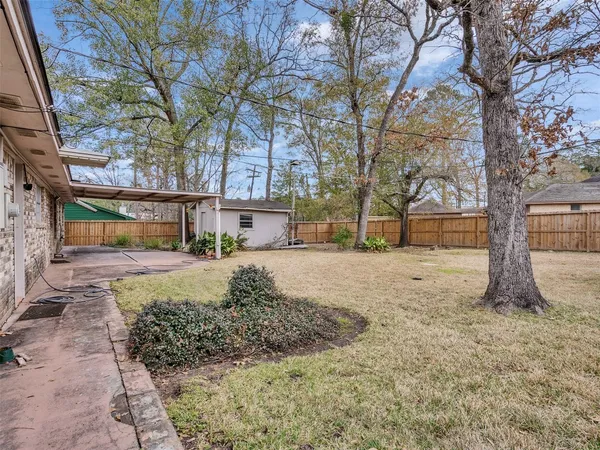 a backyard of a house with lots of green space
