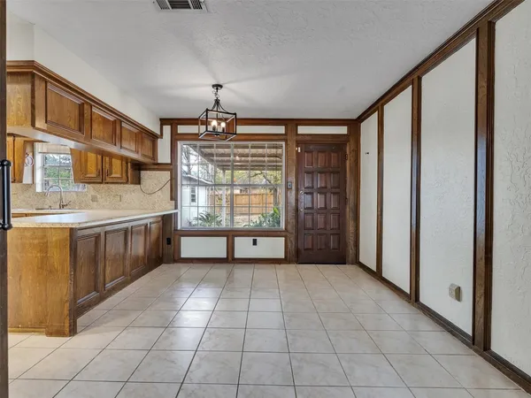 a view of a kitchen with a sink and dishwasher