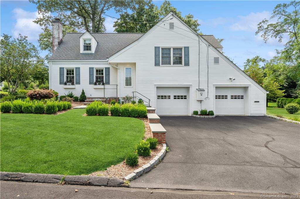 68 Ralsey Road Stamford, CT 06902 - Photo 1 of 1 a front view of a house with a yard