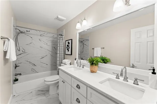 a living room with a bed furniture and window