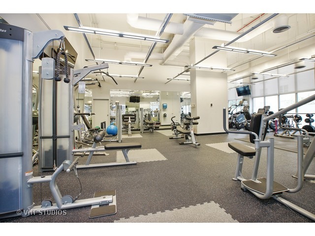 655 West Irving Park Road, Unit 4015 Chicago, IL 60613 - Photo 10 of 14 a view of a room with gym equipment
