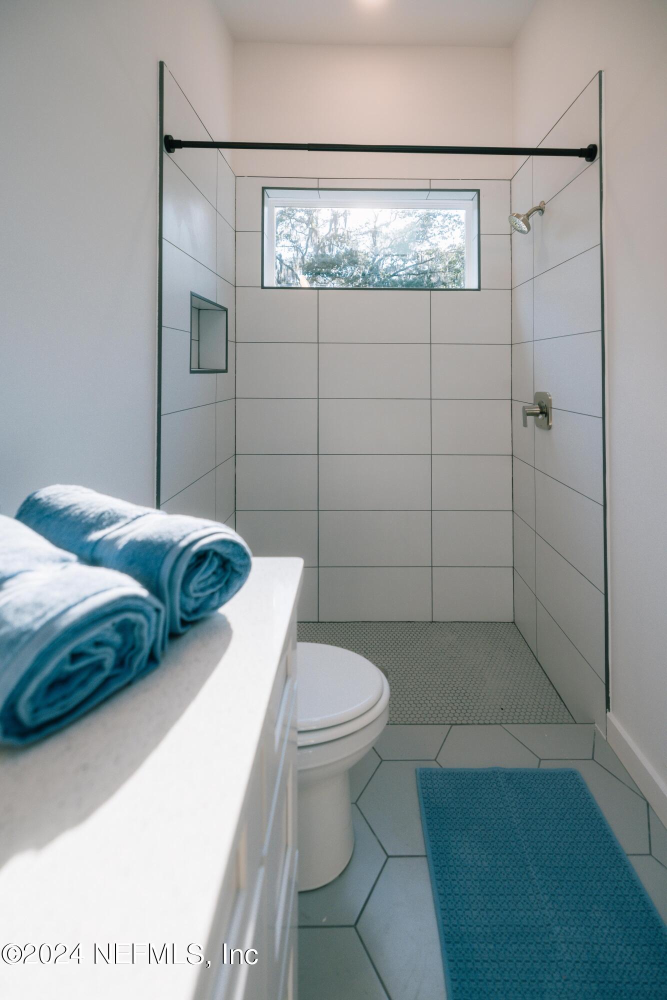 673 Julia Street St. Augustine, FL 32084 - Photo 19 of 21 a bathroom with a toilet and a shower