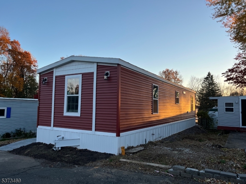 195 West Main Street, Unit 22 Chester, NJ 07930 - Photo 19 of 23 a front view of a house with a yard