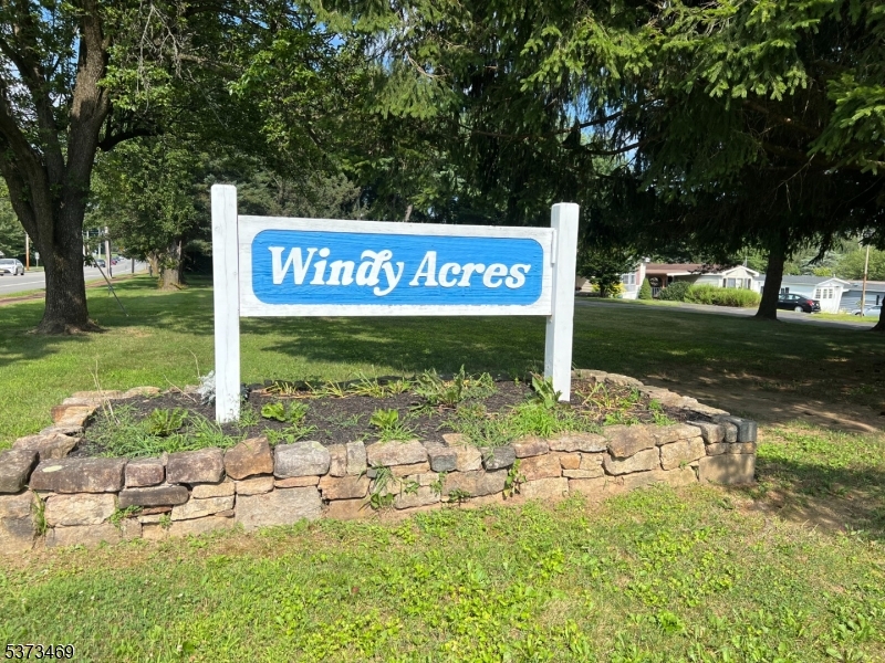 195 West Main Street, Unit 22 Chester, NJ 07930 - Photo 21 of 23 a sign board with garden