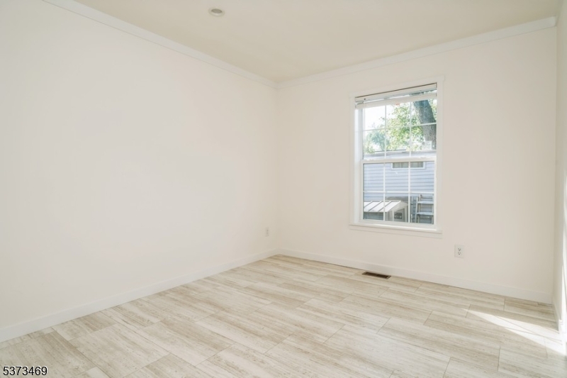 195 West Main Street, Unit 22 Chester, NJ 07930 - Photo 10 of 23 an empty room with a window