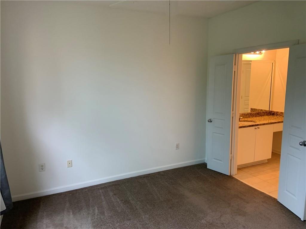 10 Perimeter Summit Boulevard, Unit 1404 Brookhaven, GA 30319 - Photo 14 of 39 an empty room with windows