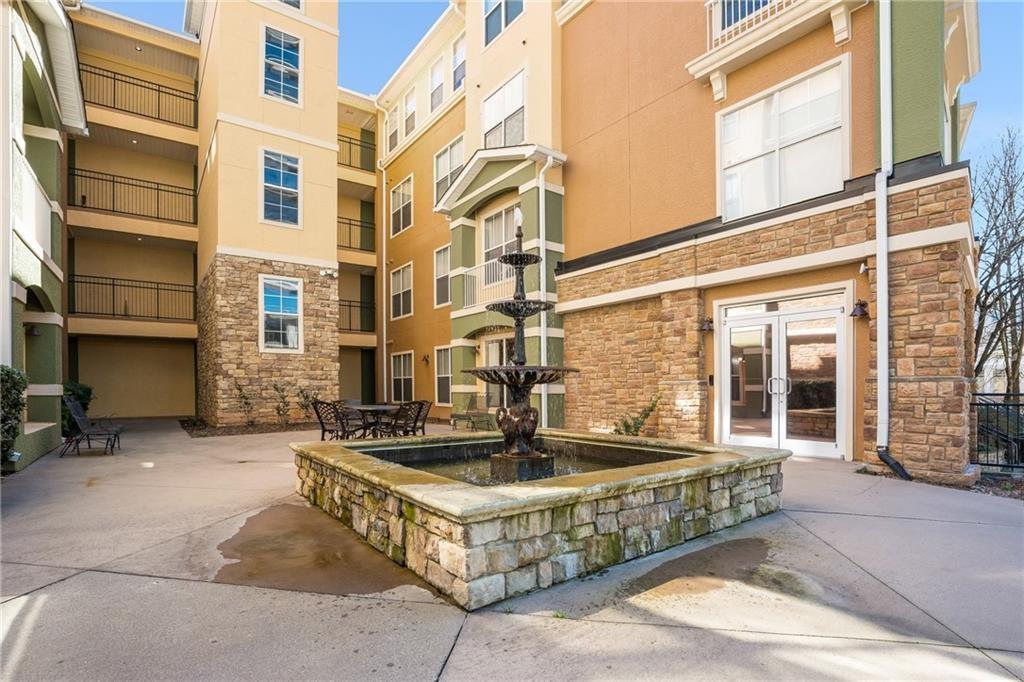 10 Perimeter Summit Boulevard, Unit 1404 Brookhaven, GA 30319 - Photo 20 of 39 a front view of a building with glass windows
