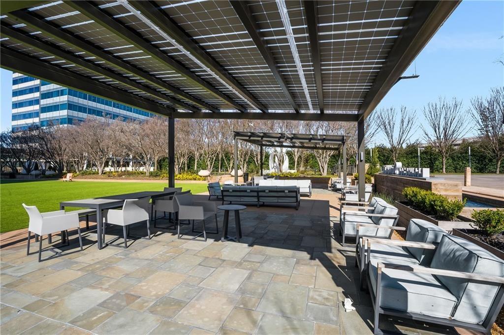 10 Perimeter Summit Boulevard, Unit 1404 Brookhaven, GA 30319 - Photo 23 of 39 a view of a chairs and table in patio with a yard