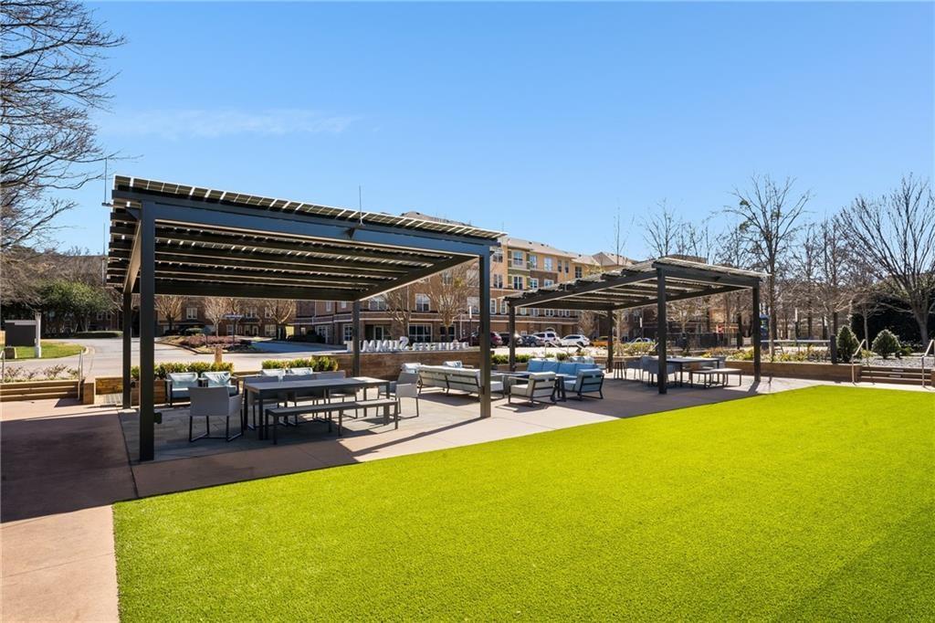 10 Perimeter Summit Boulevard, Unit 1404 Brookhaven, GA 30319 - Photo 24 of 39 a view of a swimming pool with sitting area