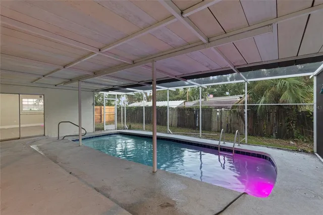 a view of a swimming pool with a porch