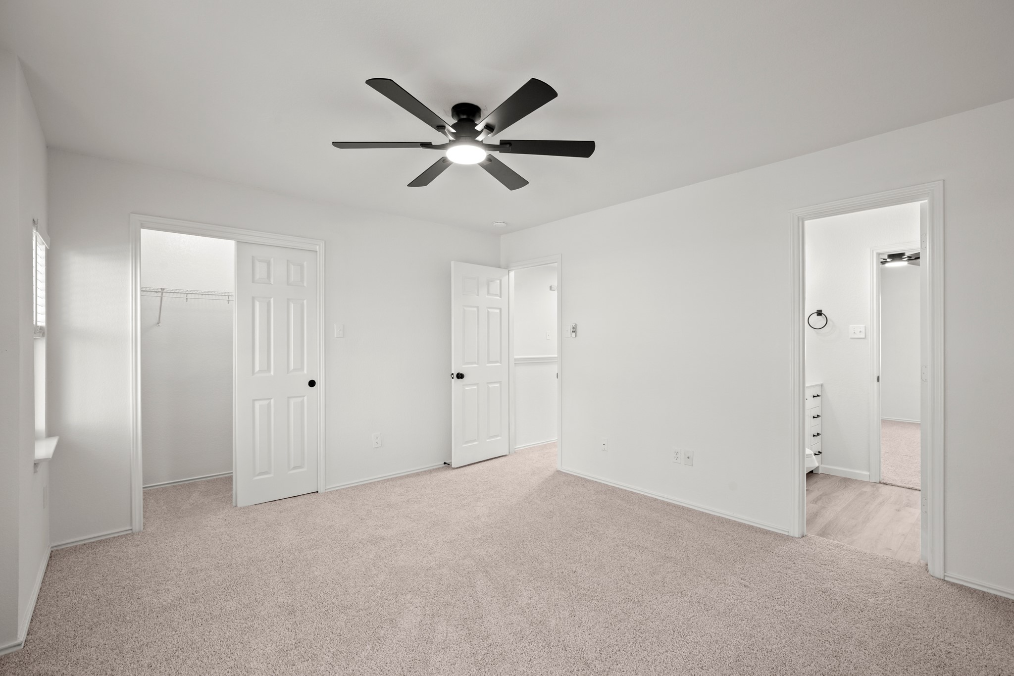 360 Sampson Kyle, TX 78640 - Photo 19 of 36 Neutral tone carpet flooring and crisp white walls provide a versatile backdrop