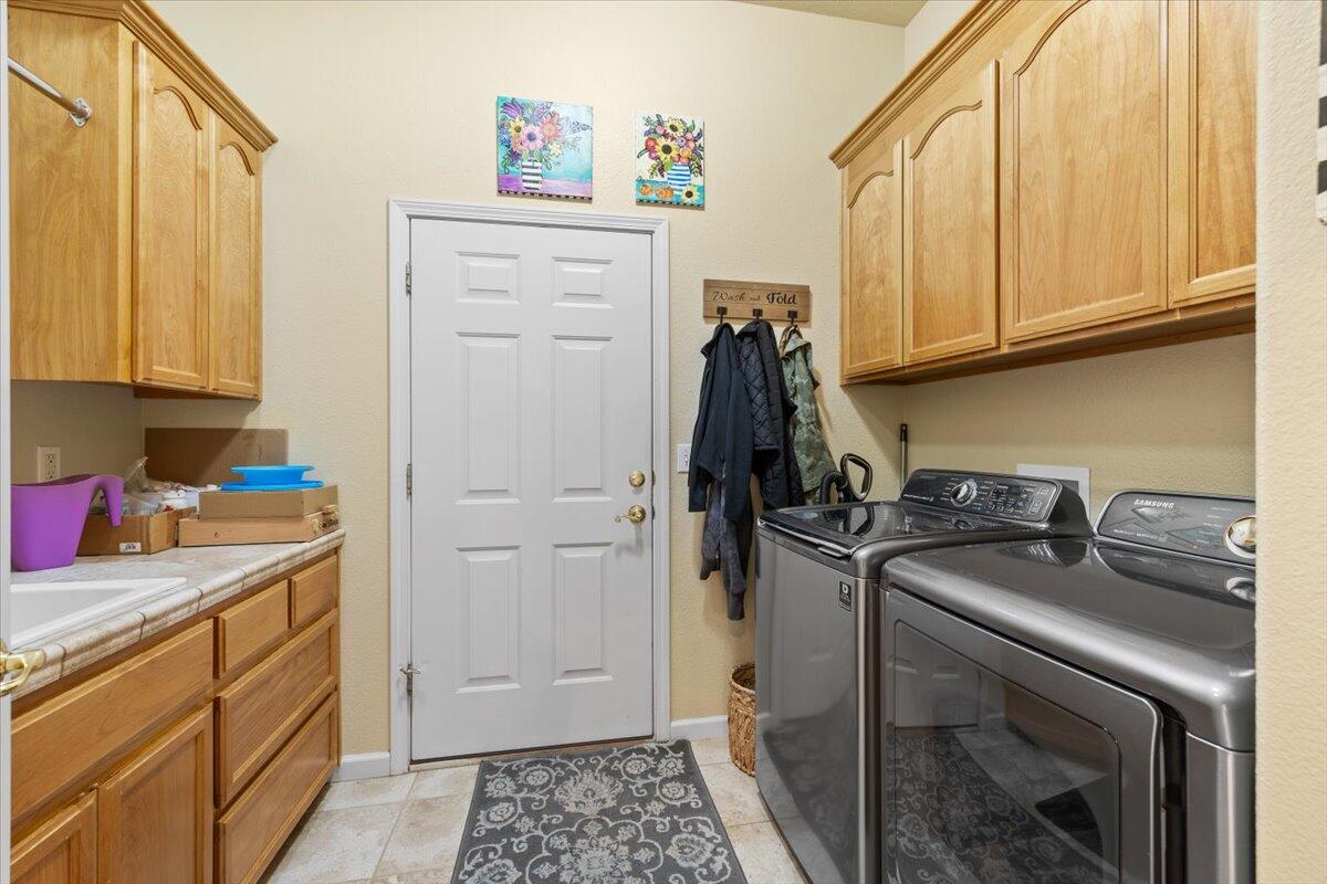 1105 Pumpkin Ridge Eagle Point, OR 97524 - Photo 22 of 40 a kitchen with a sink and cabinets