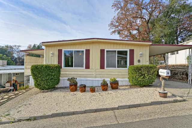 a view of living room with furniture and windows