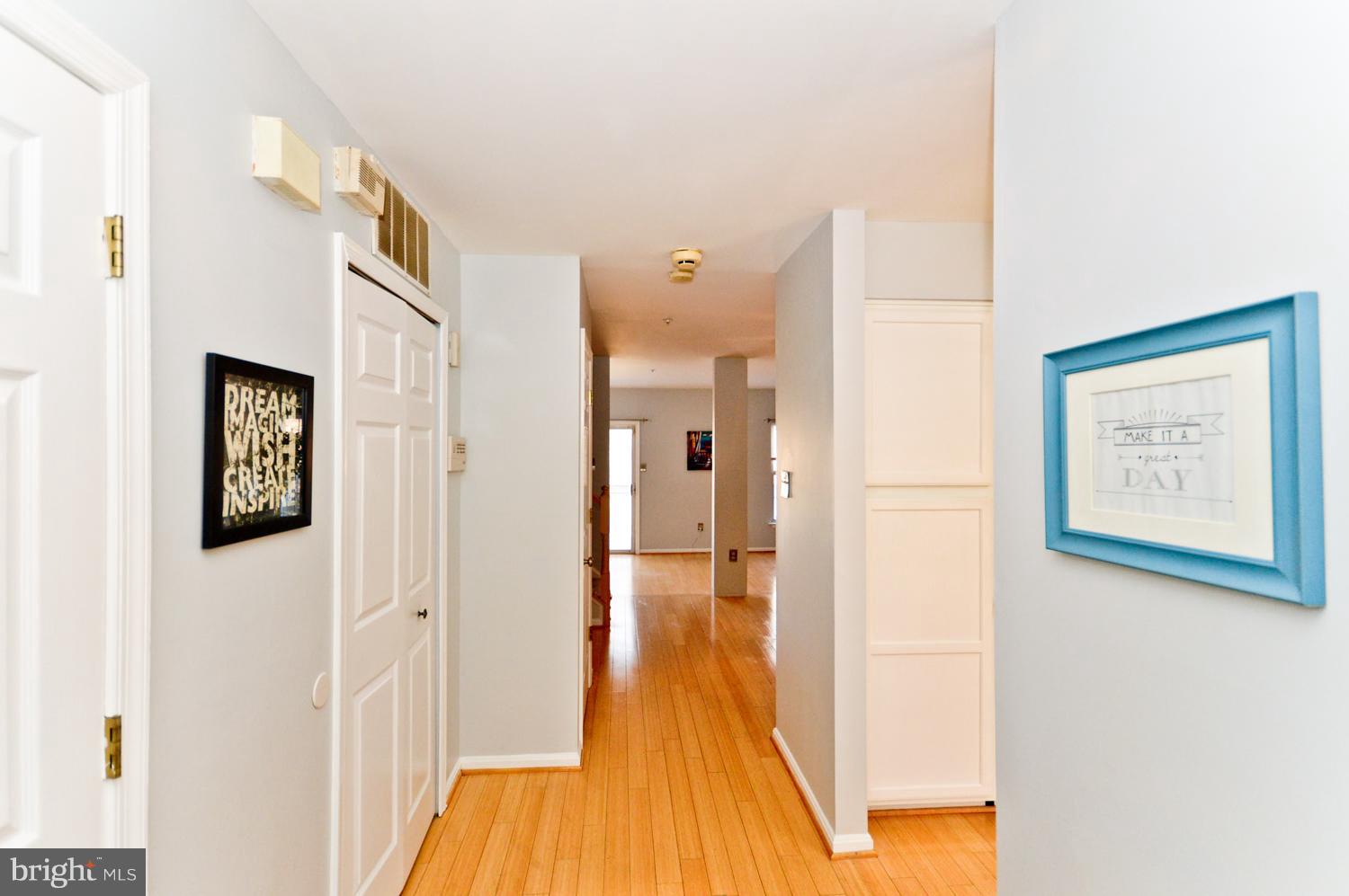 9923 Raintree Way Clinton, MD 20735 - Photo 2 of 30 a view of a hallway with wooden floor