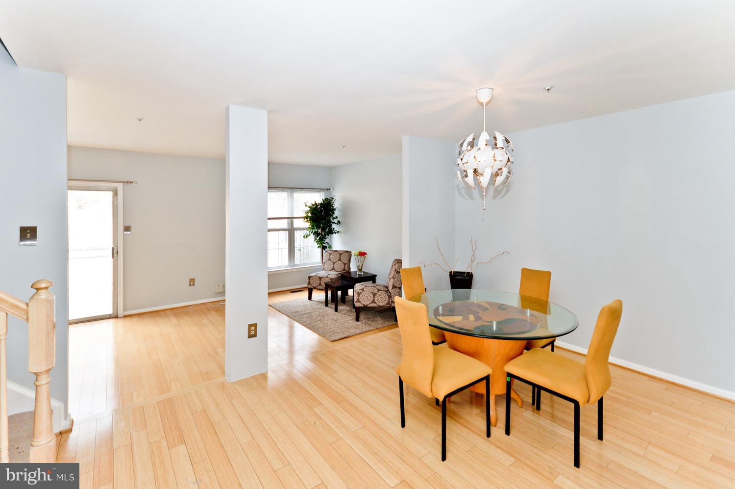 9923 Raintree Way Clinton, MD 20735 - Photo 11 of 30 a view of a dining room with furniture and wooden floor