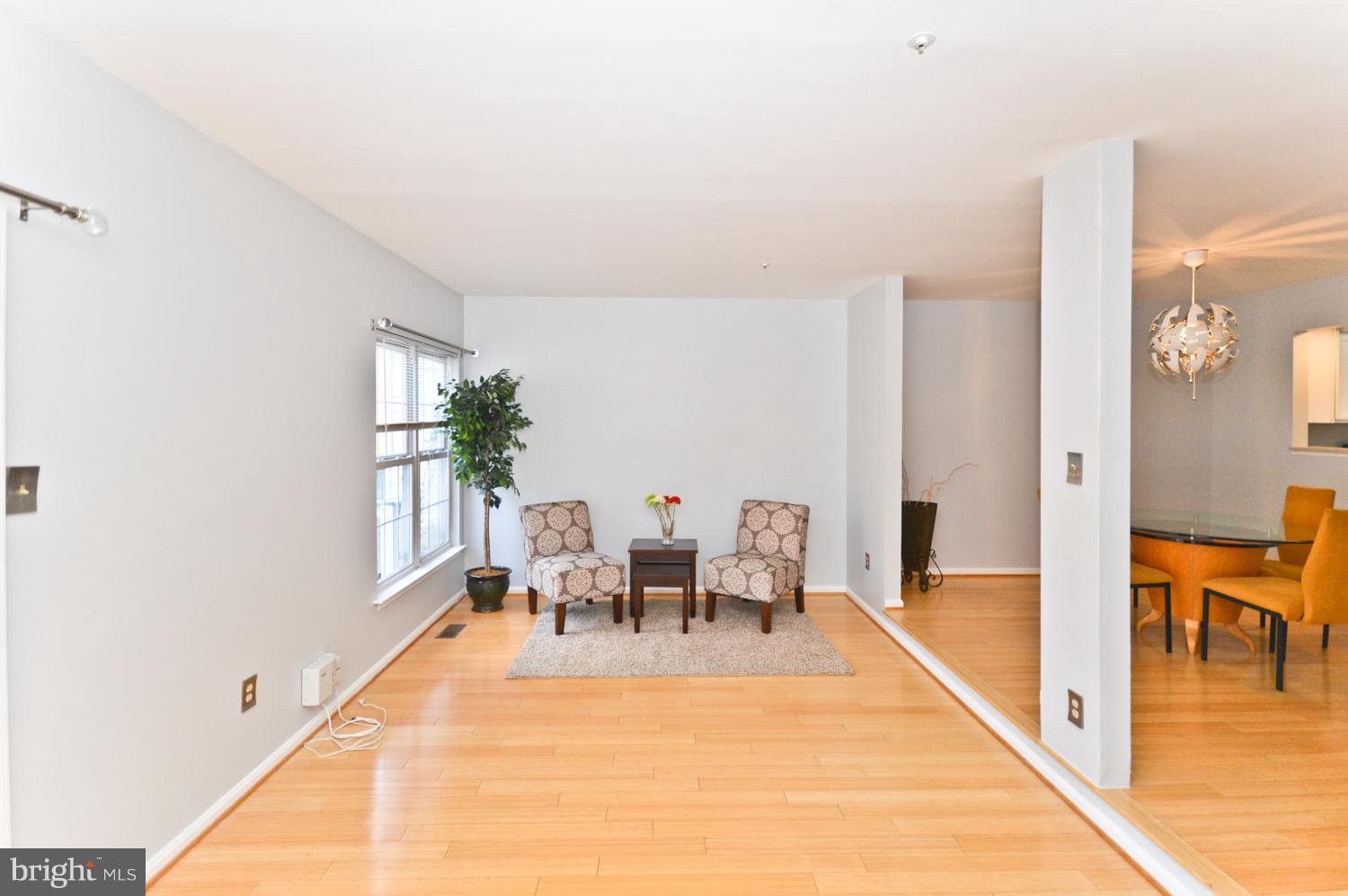 9923 Raintree Way Clinton, MD 20735 - Photo 13 of 30 a living room with furniture a dining table with wooden floor