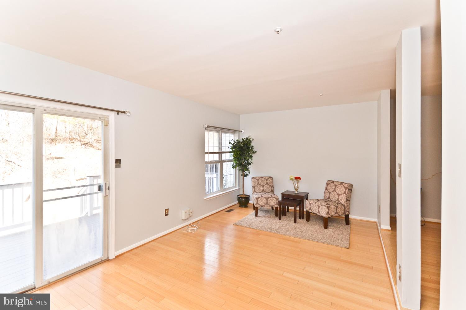 9923 Raintree Way Clinton, MD 20735 - Photo 14 of 30 a living room with furniture and large window