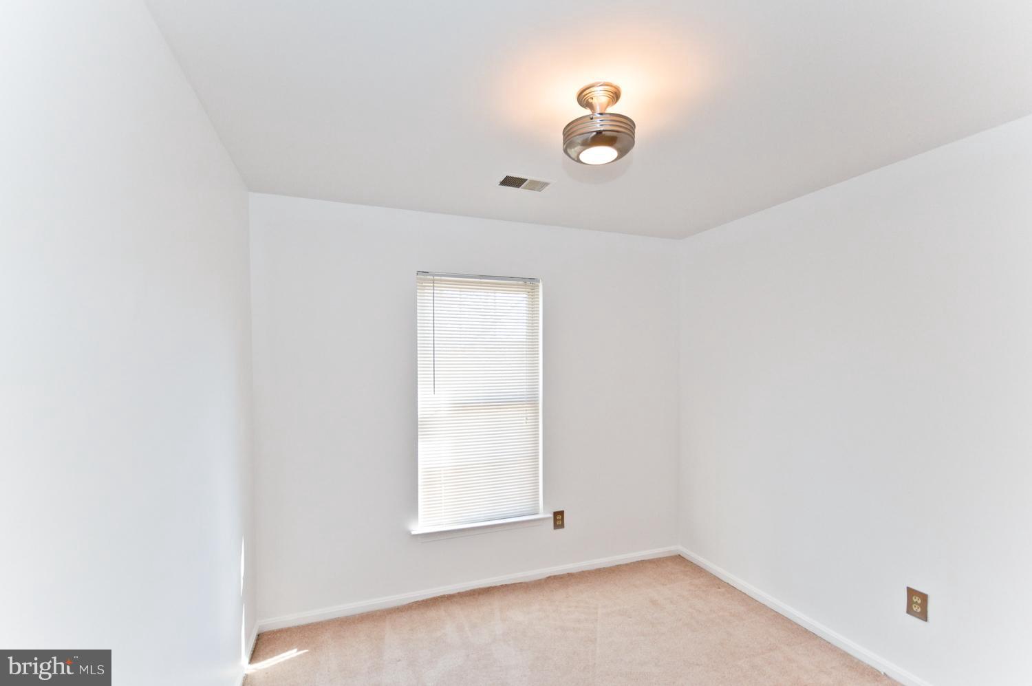 9923 Raintree Way Clinton, MD 20735 - Photo 18 of 30 an empty room with a window