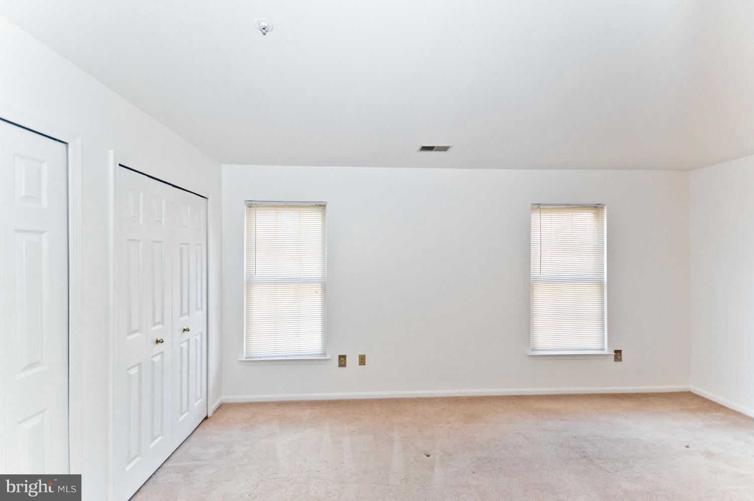 9923 Raintree Way Clinton, MD 20735 - Photo 21 of 30 an empty room with windows