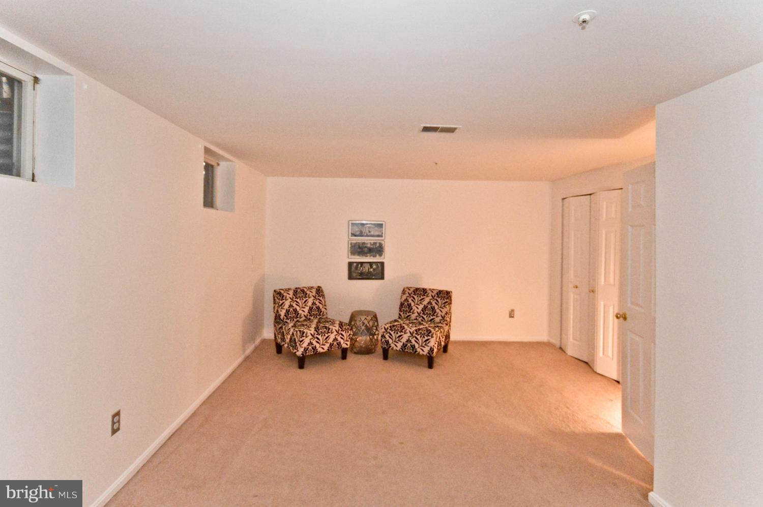 9923 Raintree Way Clinton, MD 20735 - Photo 25 of 30 a bed room with furniture and a window