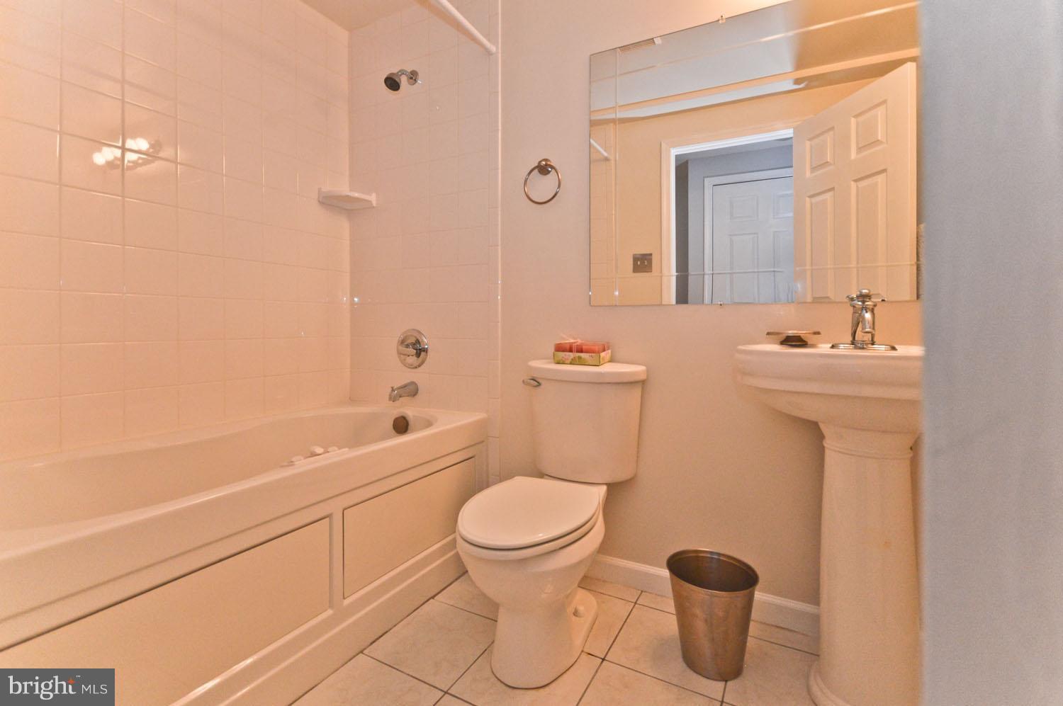 9923 Raintree Way Clinton, MD 20735 - Photo 28 of 30 a bathroom with a sink toilet and shower