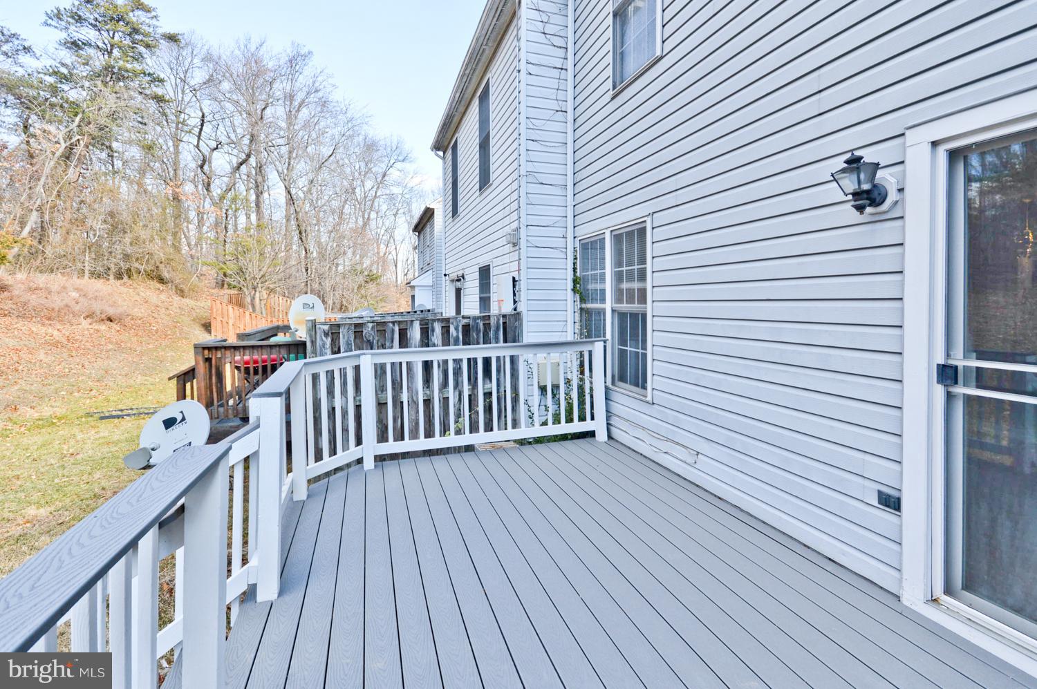 9923 Raintree Way Clinton, MD 20735 - Photo 30 of 30 a view of a wooden deck with a yard