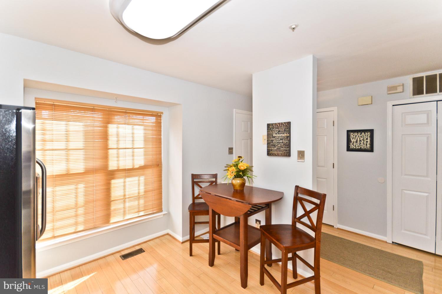 9923 Raintree Way Clinton, MD 20735 - Photo 5 of 30 a dining room with furniture and a large window