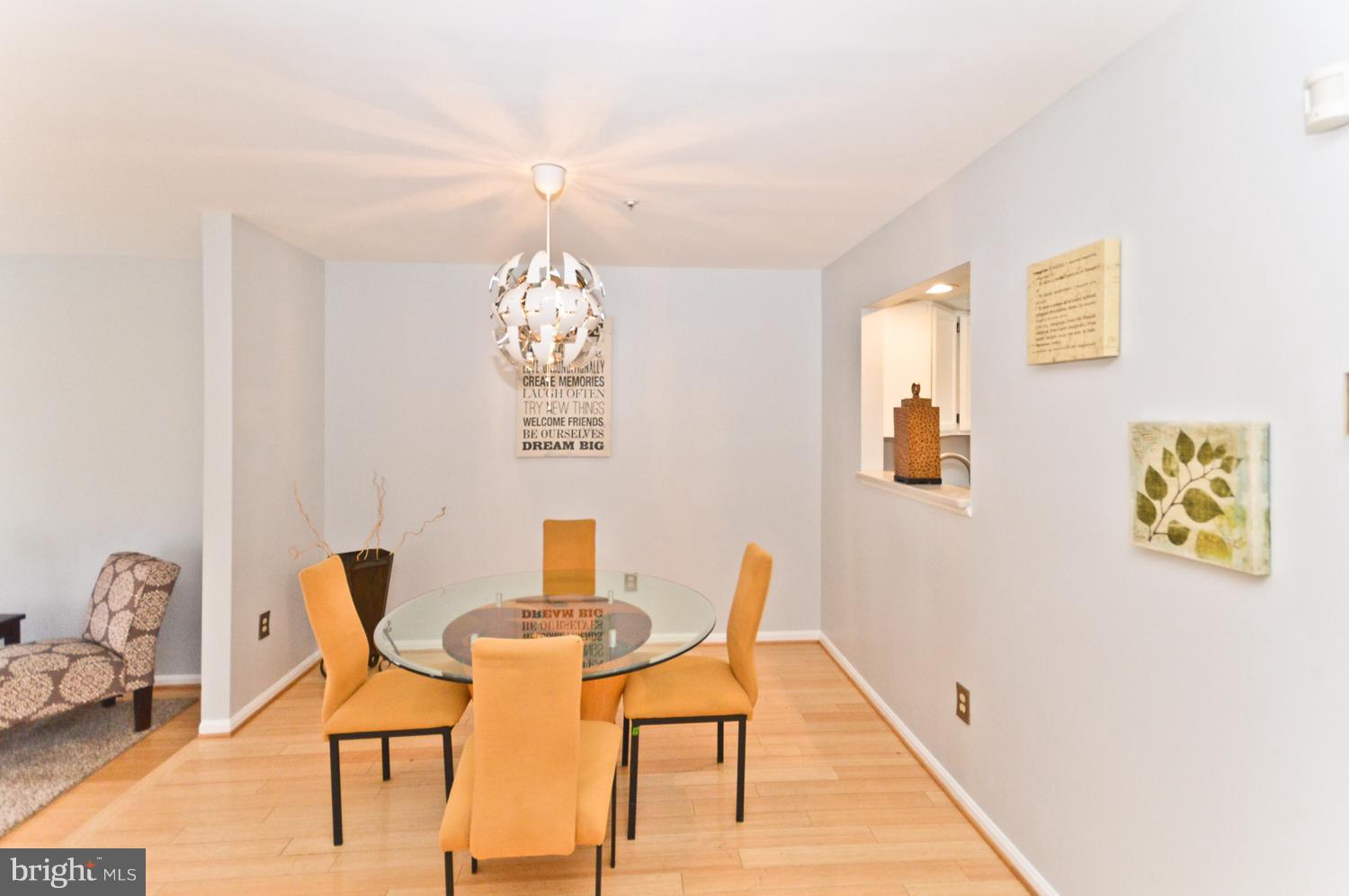 9923 Raintree Way Clinton, MD 20735 - Photo 9 of 30 a dining room with furniture and chandelier