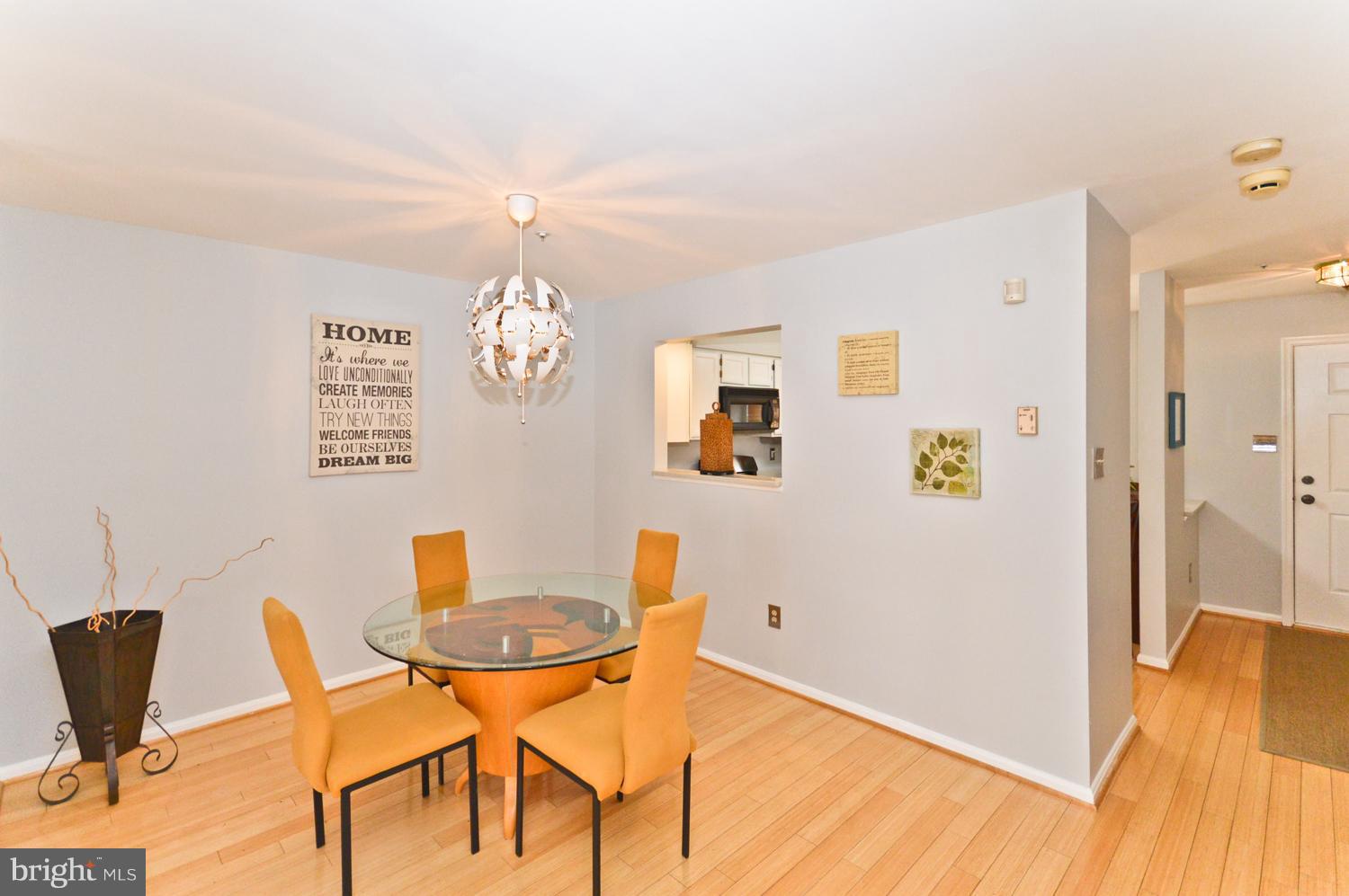 9923 Raintree Way Clinton, MD 20735 - Photo 10 of 30 a view of a dining room with furniture and wooden floor