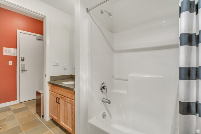 1364 Still Water Drive, Unit R3005 Heber City, UT 84032 - Photo 12 of 28 Bathroom featuring shower / bath combo with shower curtain, vanity, and light tile patterned floors