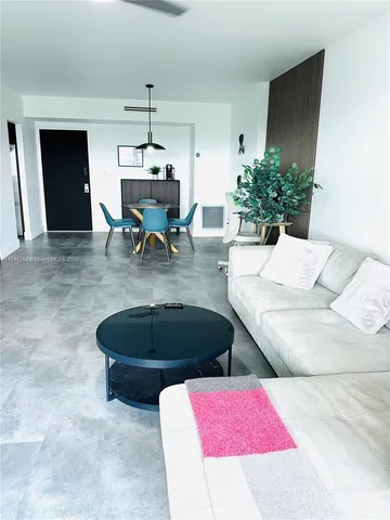 a view of a livingroom with furniture and window