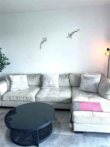 a bathroom with a shower and mirror