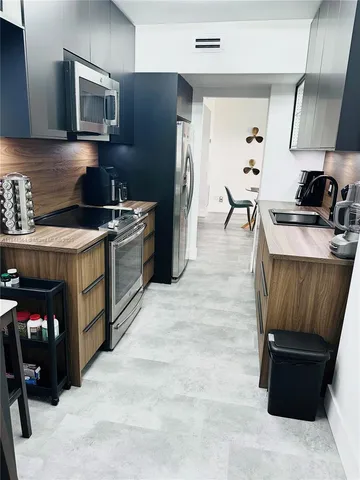 a view of a livingroom with furniture and a couch