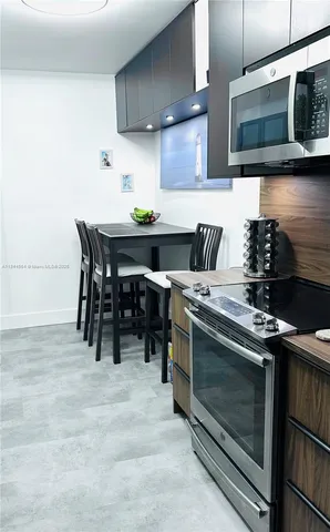 a living room with a sink and garden view