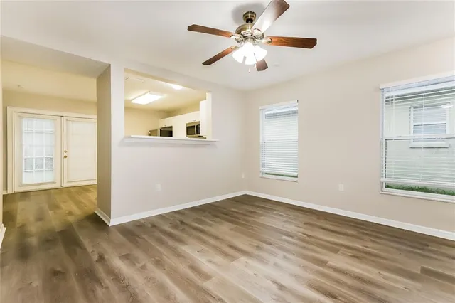 wooden floor in an empty room with a window