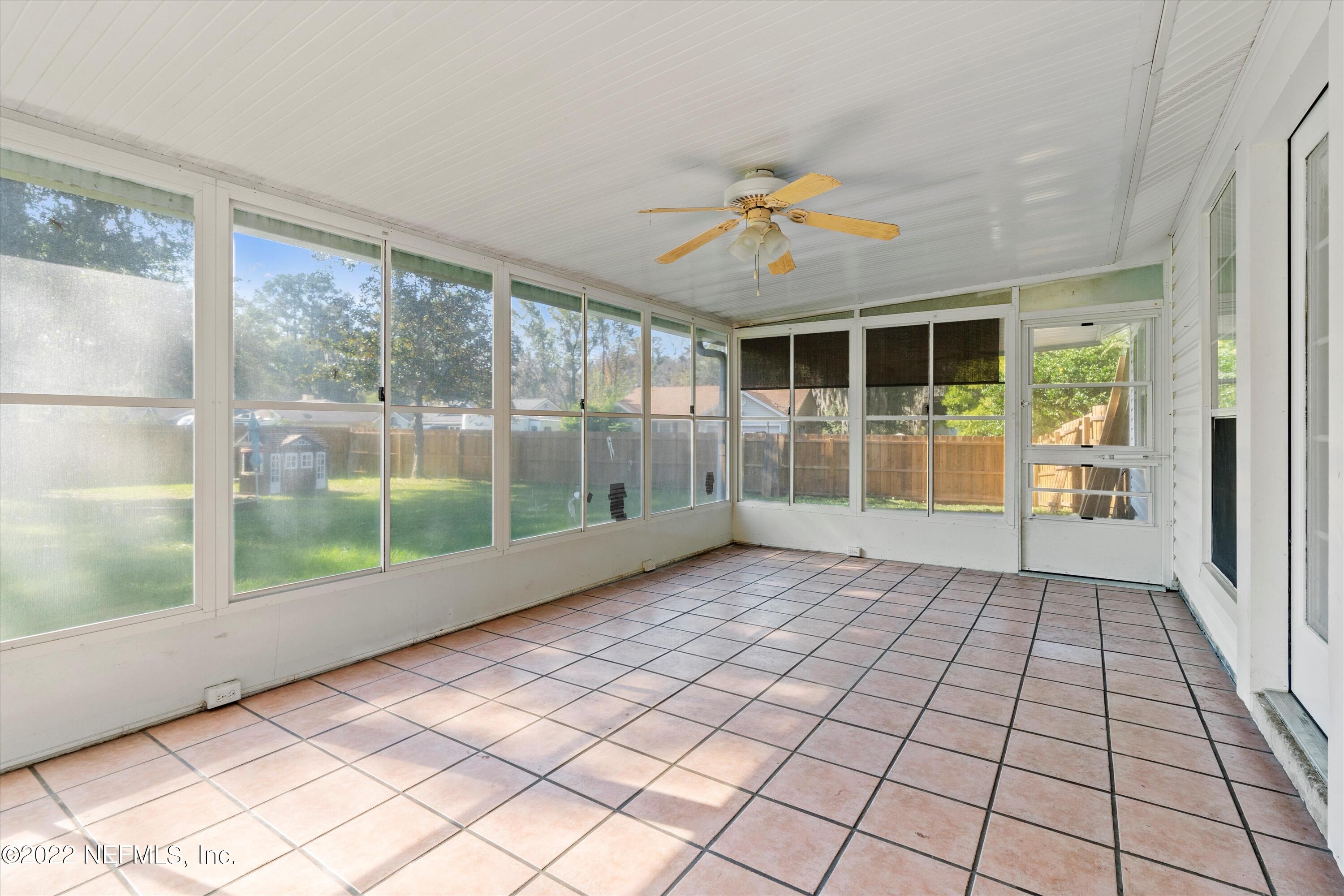 10498 Rothbury Court Jacksonville, FL 32221 - Photo 25 of 35 a view of empty room with wooden floor and fan