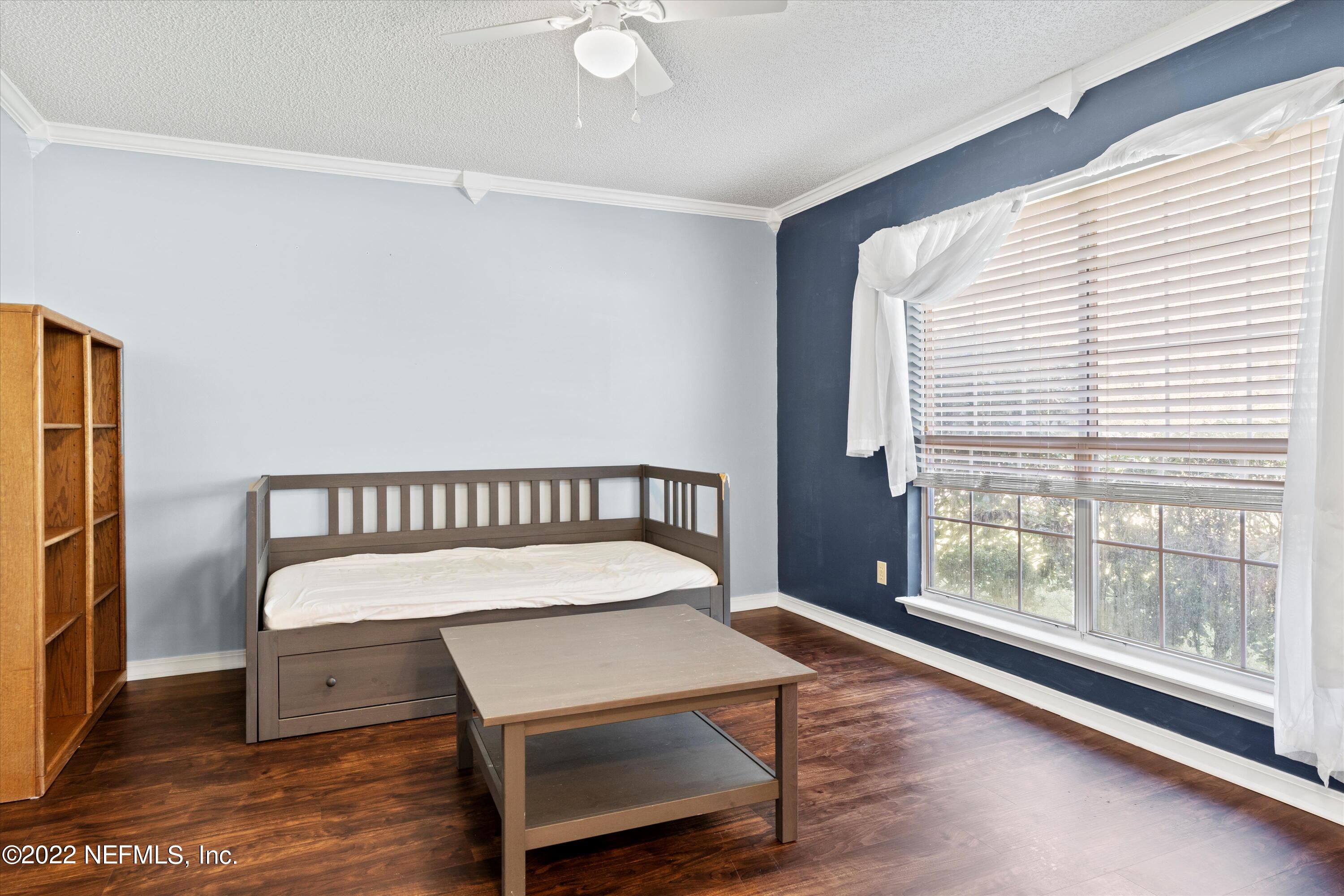 10498 Rothbury Court Jacksonville, FL 32221 - Photo 6 of 35 a view of a room with wooden floor and windows